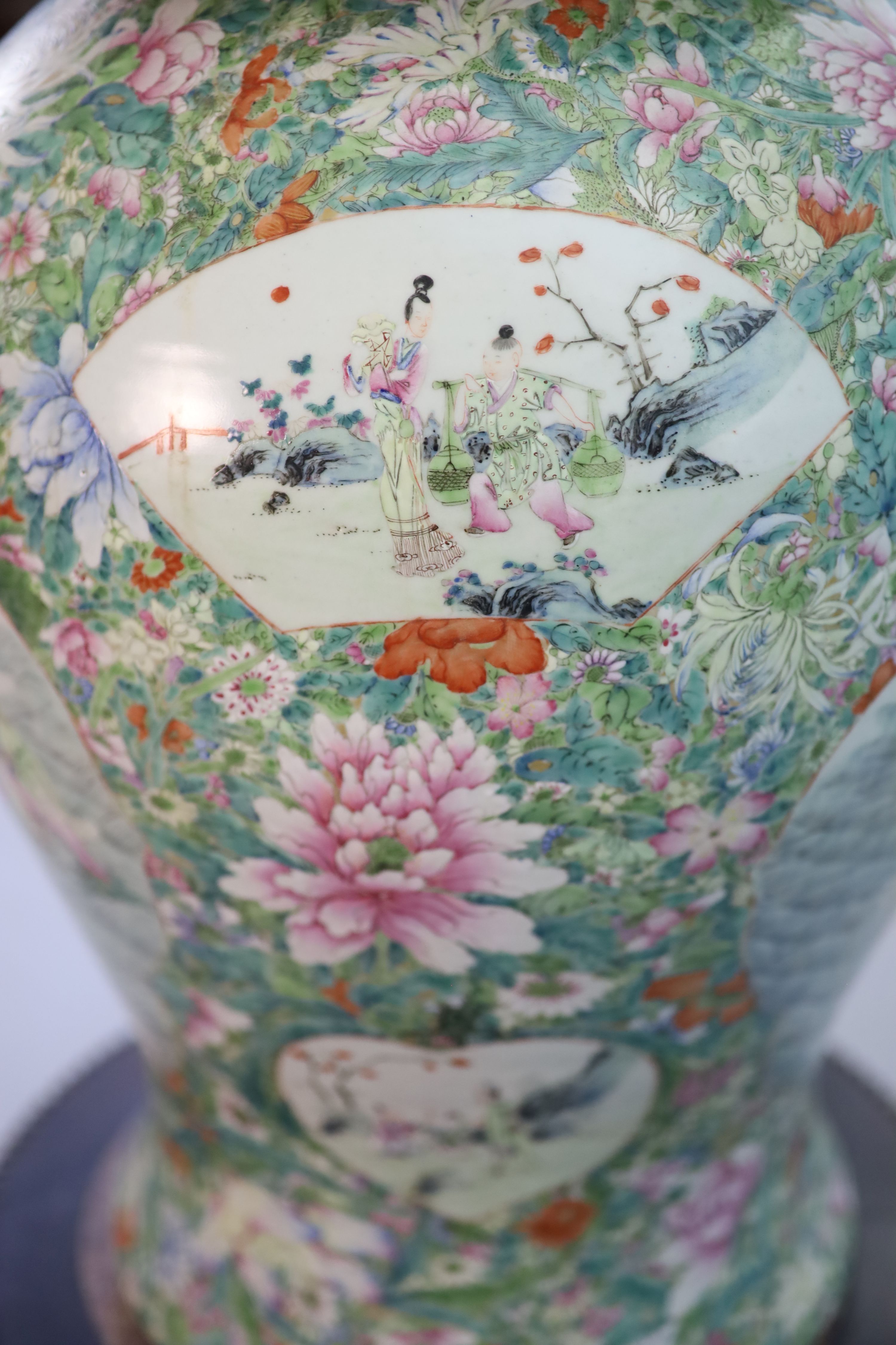 An impressive pair of Chinese famille rose ‘eight immortals’ vases and covers, late 19th century, Total height 113.5 cm including stands